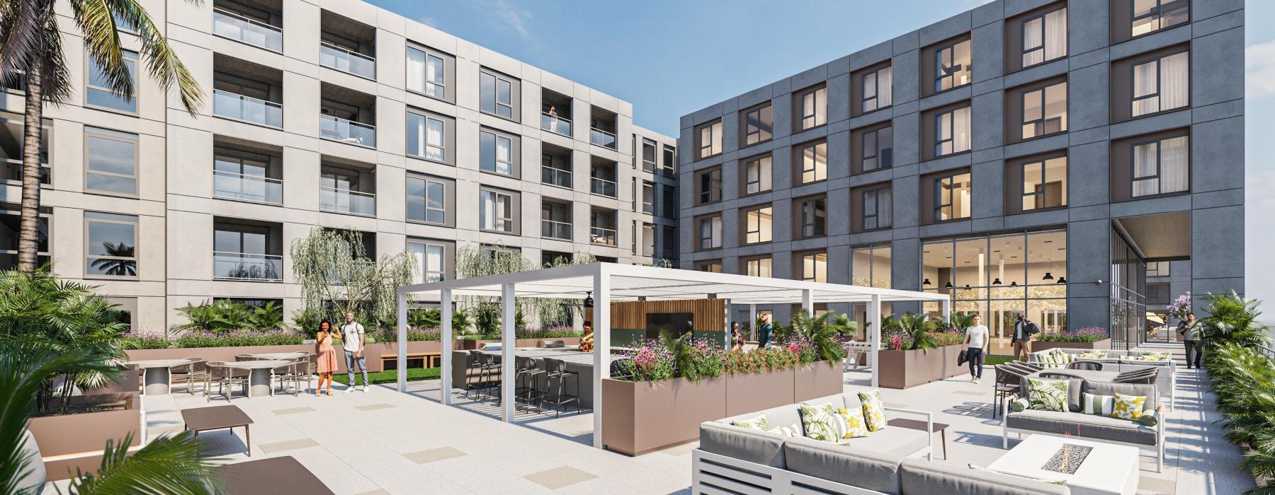 a courtyard with tables and chairs and a building in the background