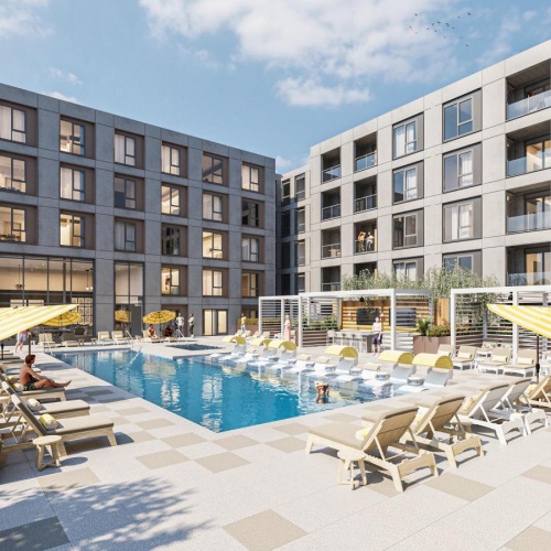 a swimming pool in a courtyard in front of a building