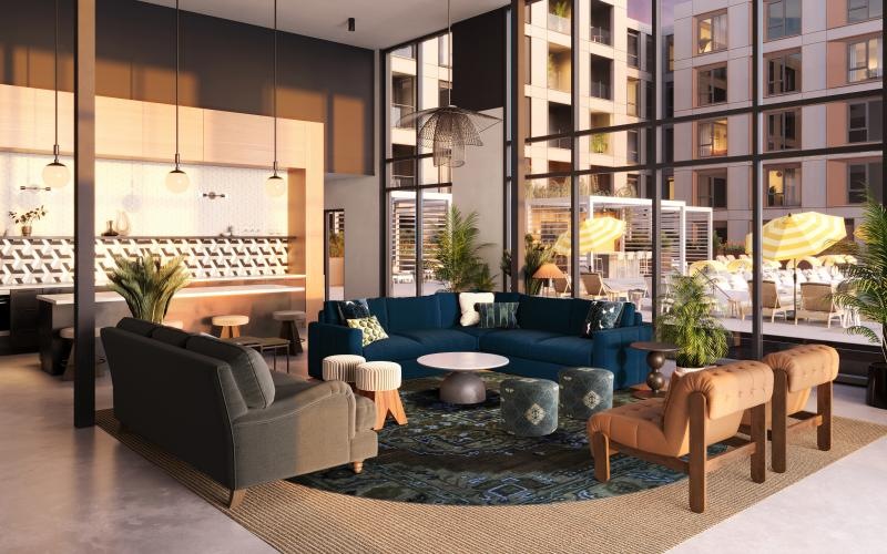 a modern looking lounge room with large windows and seating