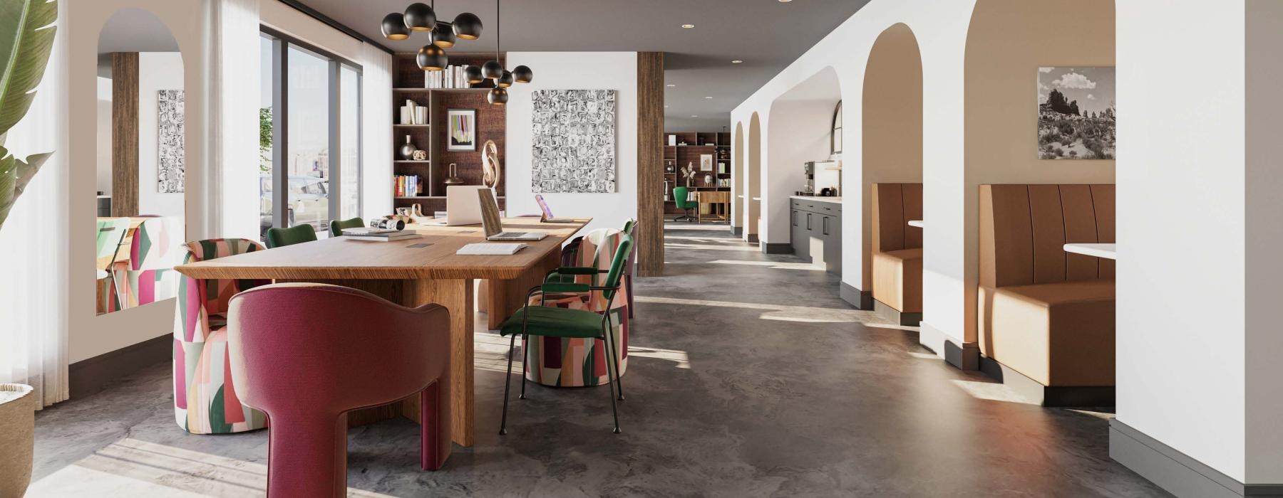 a work room with a table chairs and booths