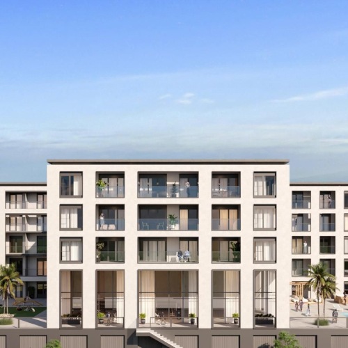 a building with many windows and a pool