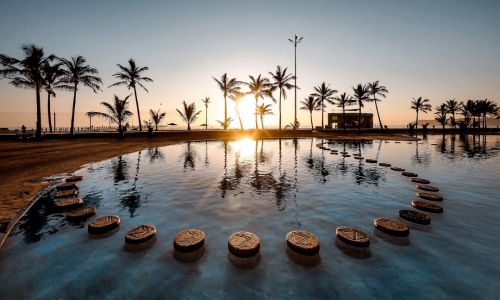 resort style pool with cabanas at sunset - Resort style apartment living